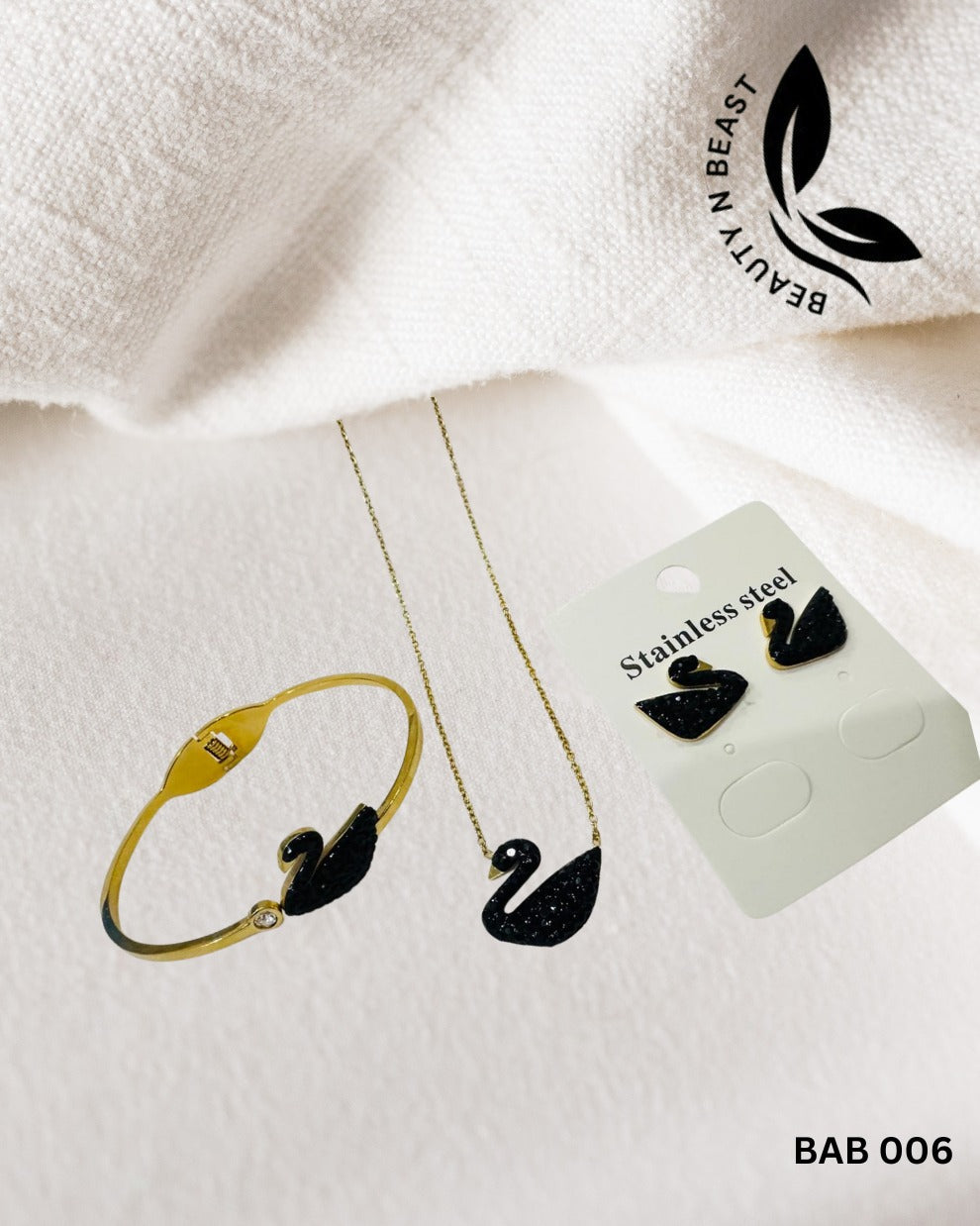 Stainless Steel Black Swan pair of handcuff and ear studs